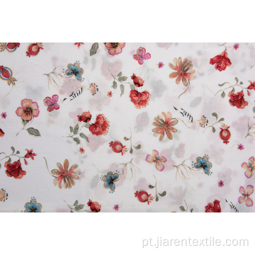 Tecidos impressos em fundo branco com padrão de flores pequenas